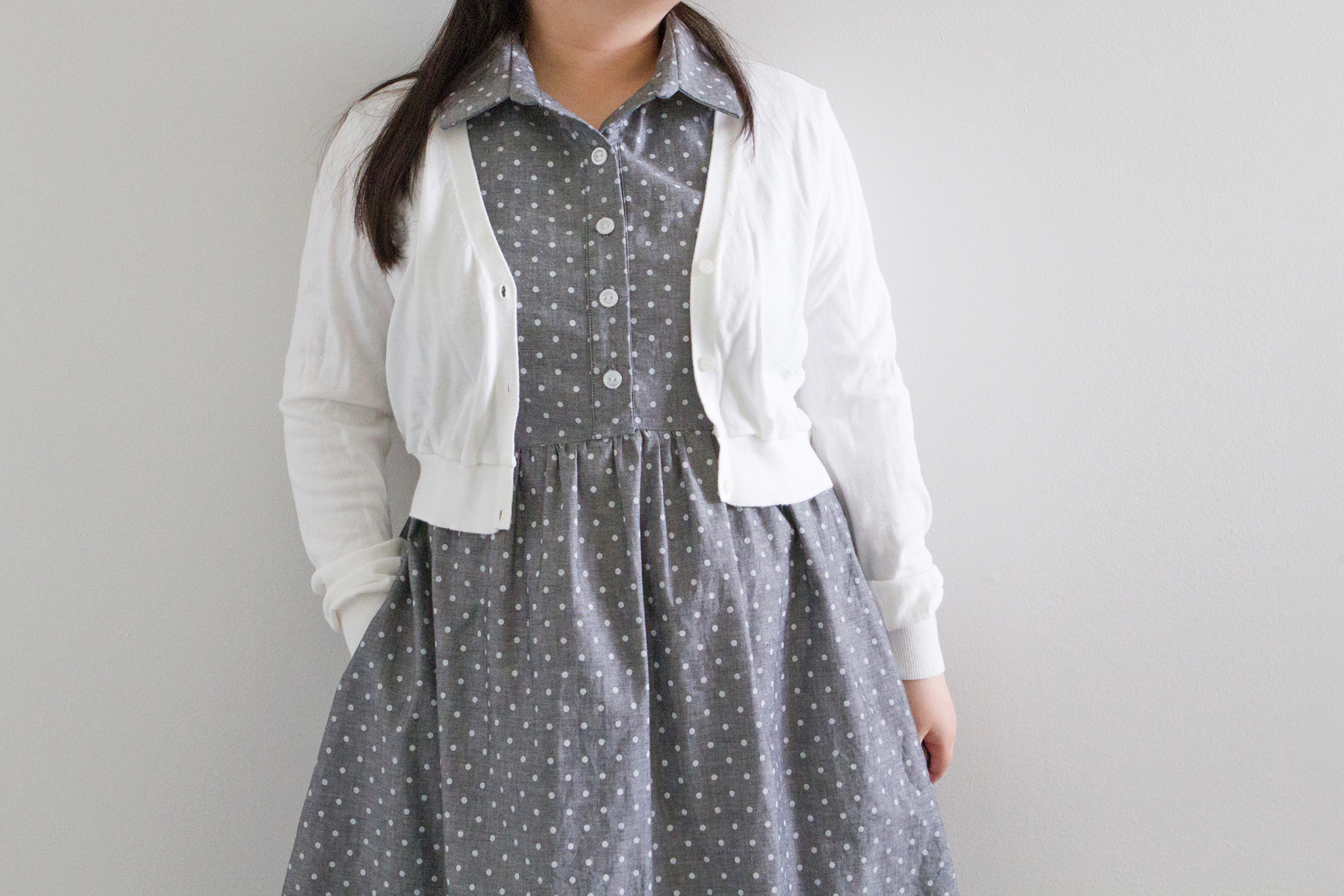 With a cardigan