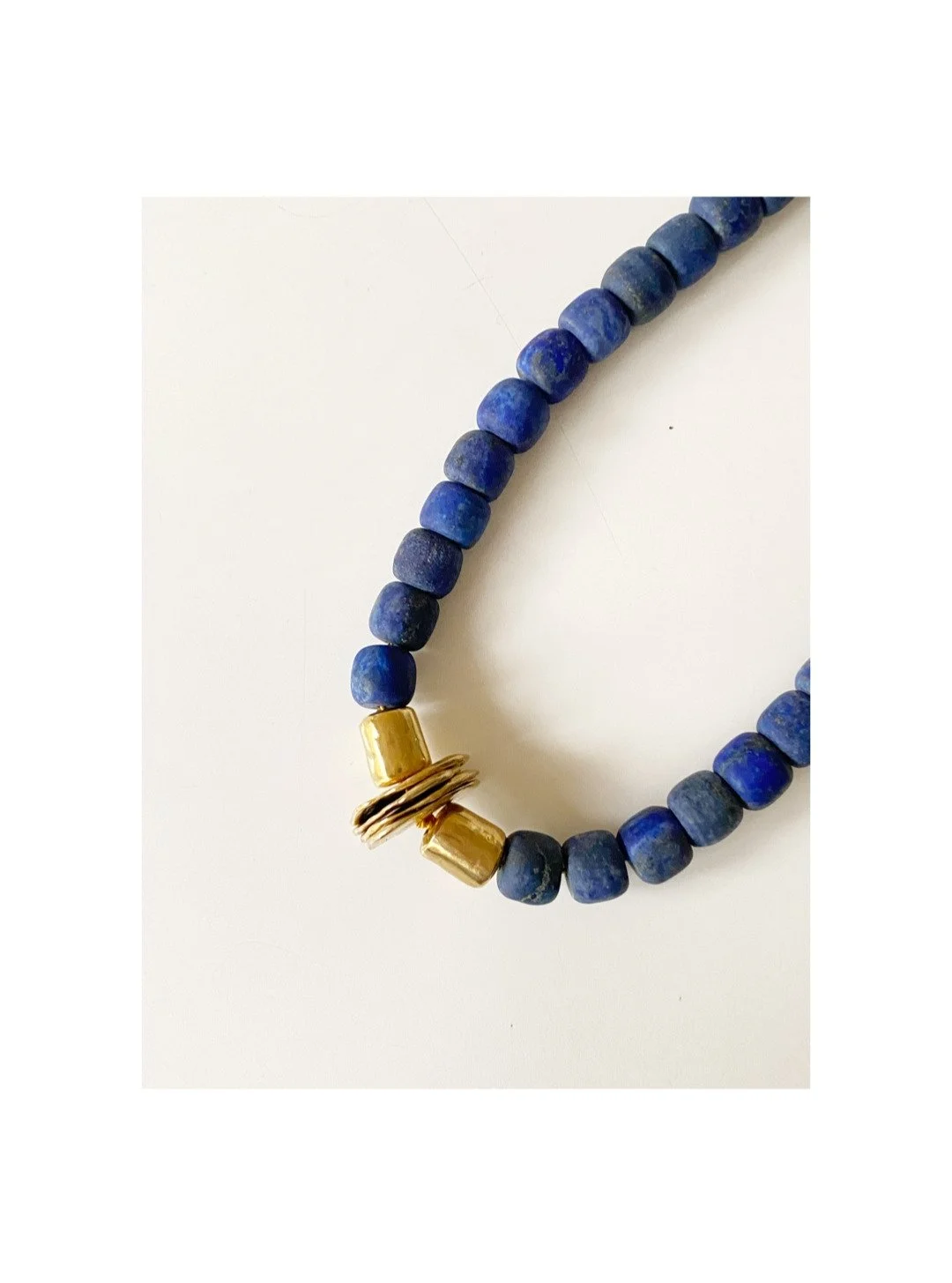 There is an intimacy to wearing art against the body. The weight of it. The temperature as metal warms the skin. The private knowledge of its making &mdash; understanding that someone's hands shaped this form, that it existed first as vision, then as