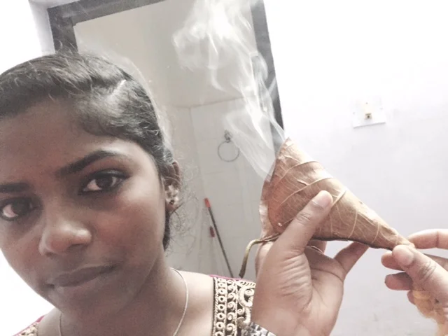 Ear steaming using a jackfruit leaf rolled into cone shape with special smoke stick, then oil into ears