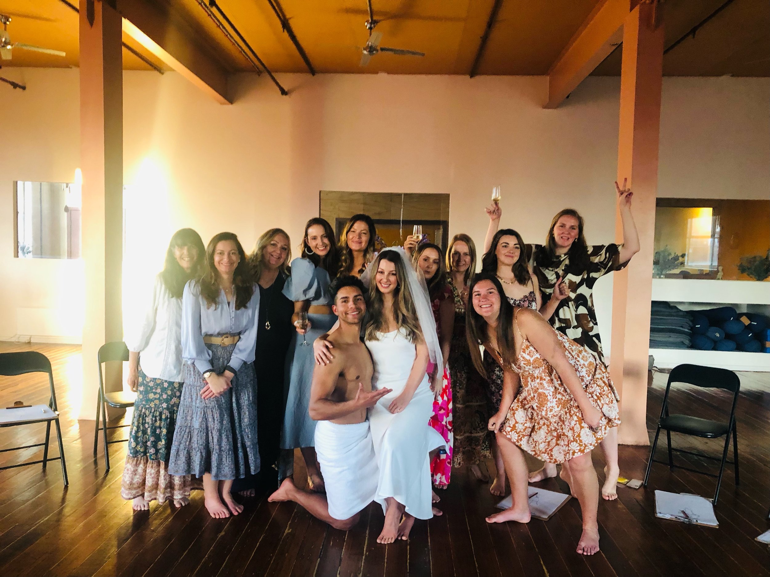 Alt text handsome male model posing with hens party in Fitzroy studio Melbourne