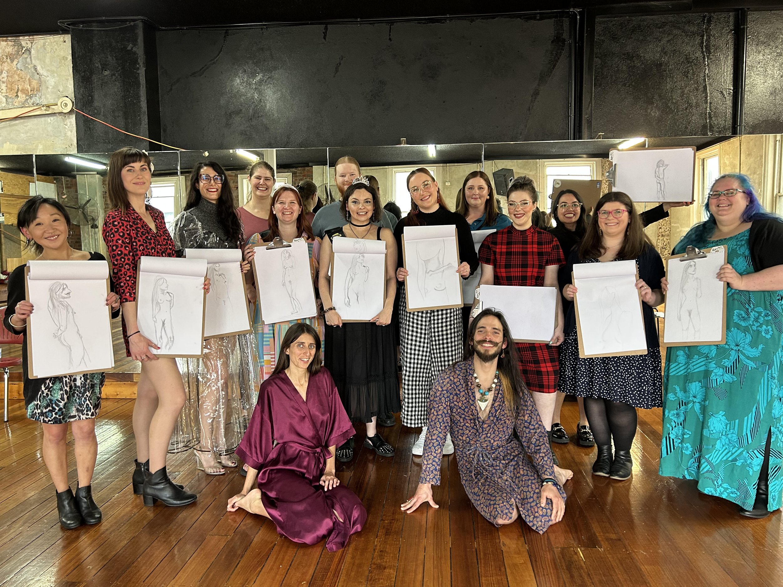 class of office workers posing with female and male models