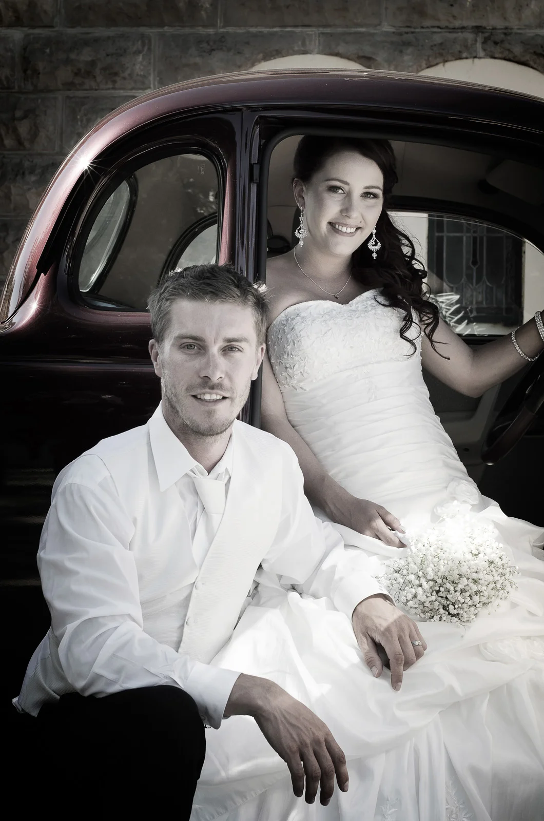 Cute couple in a classic car at their country wedding. Our Lady of Immaculate Conception Church, Dardanup. South West.