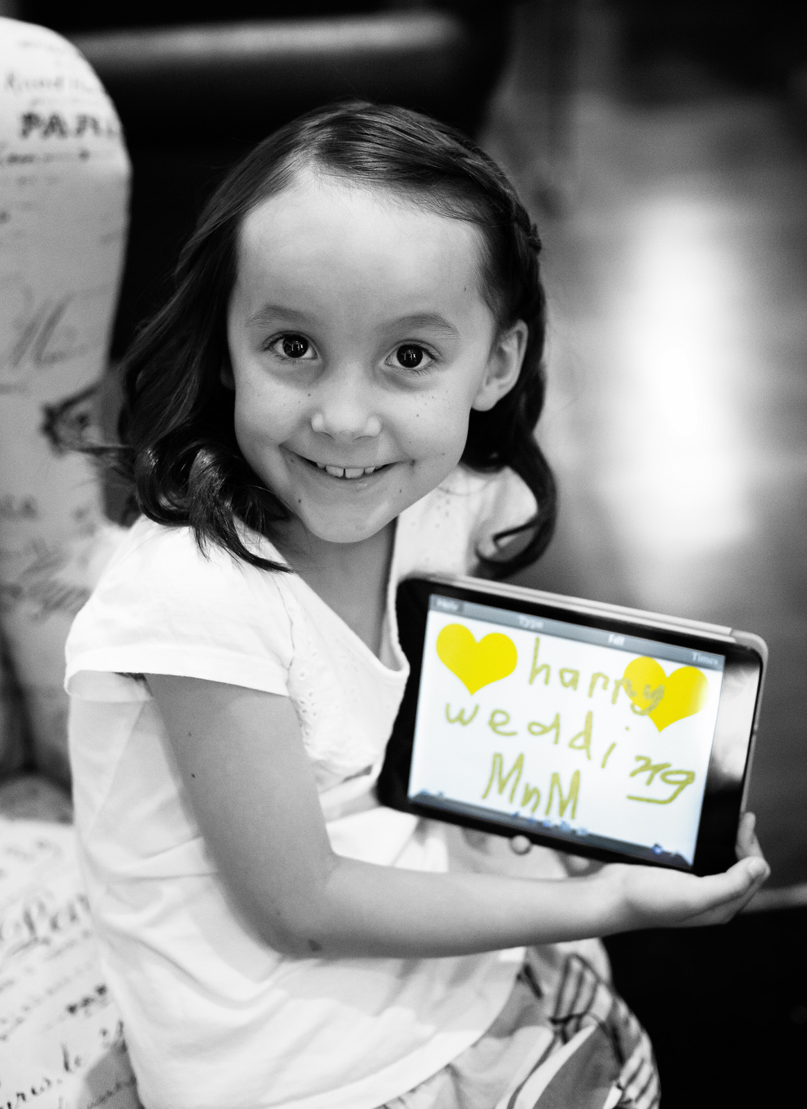 "Happy Wedding Mum" written on iPad shown by the Brides daughter