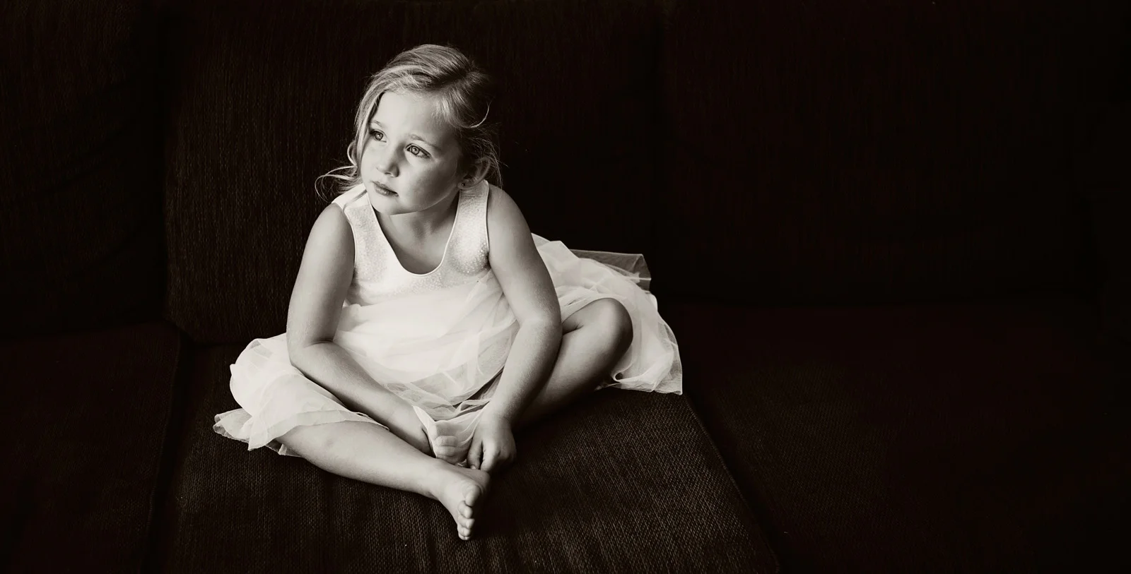 Flower Girl thinking pensively alone while Bride get ready