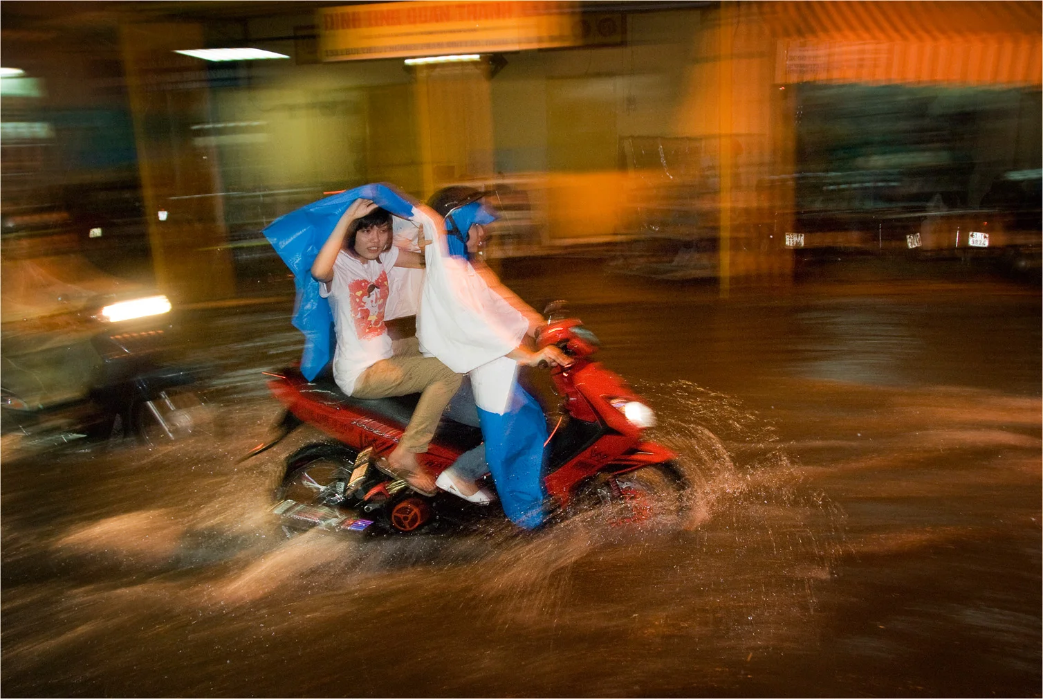Pushing through the Saigon Rain.jpg