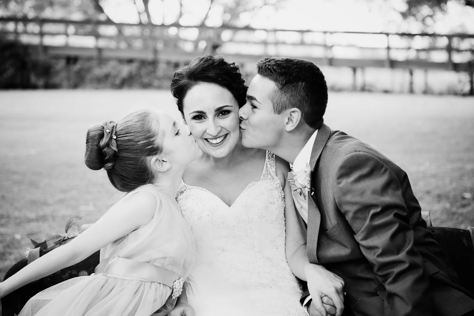 best friend and flower girl kissing the bride on the cheek. Caversham Estate. Swan Valley