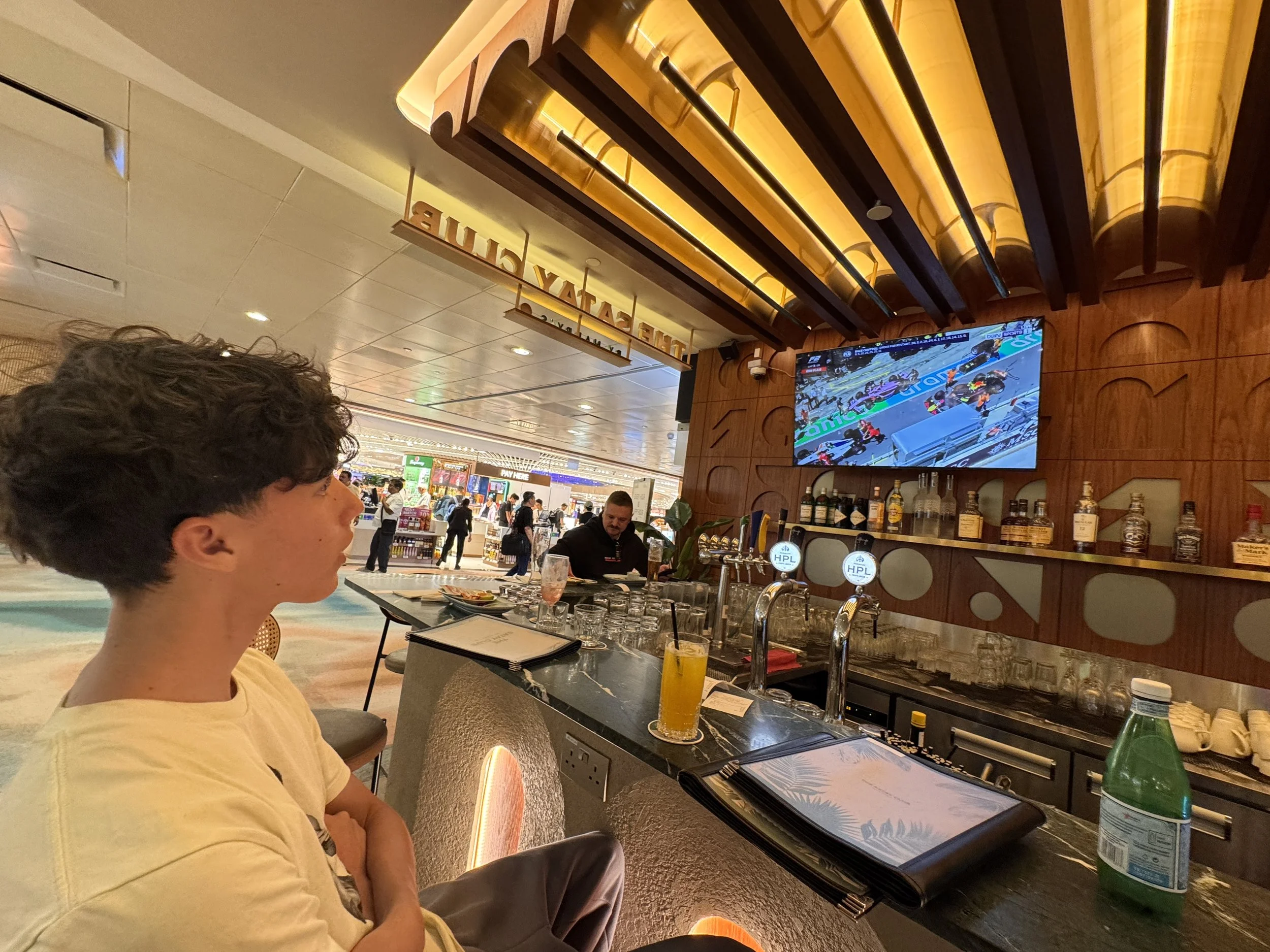 Watching F2 racing in a Singapore Airport pub to pass the time