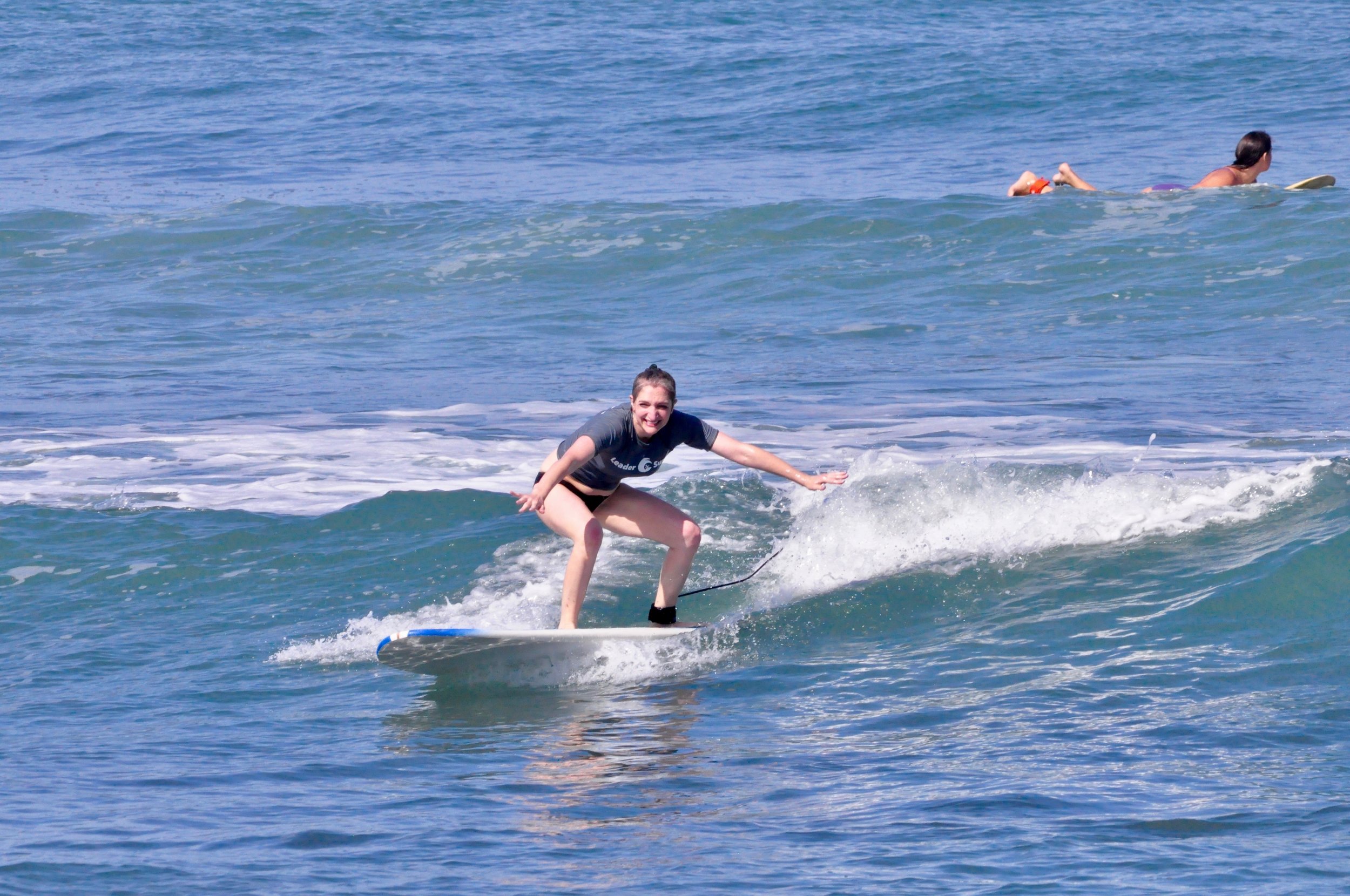 Ally riding a wave
