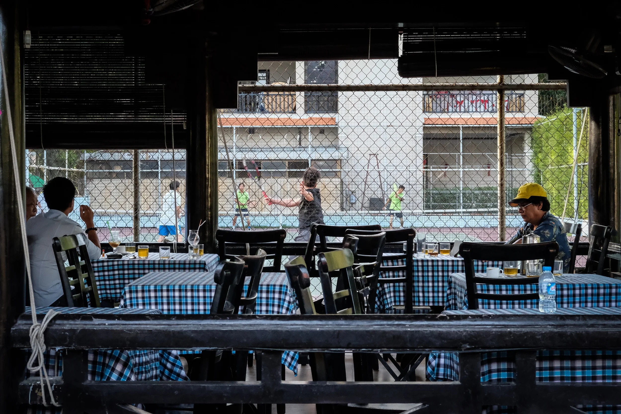 Sidewalk cafe with a view to the tennis court, just outside the old district.