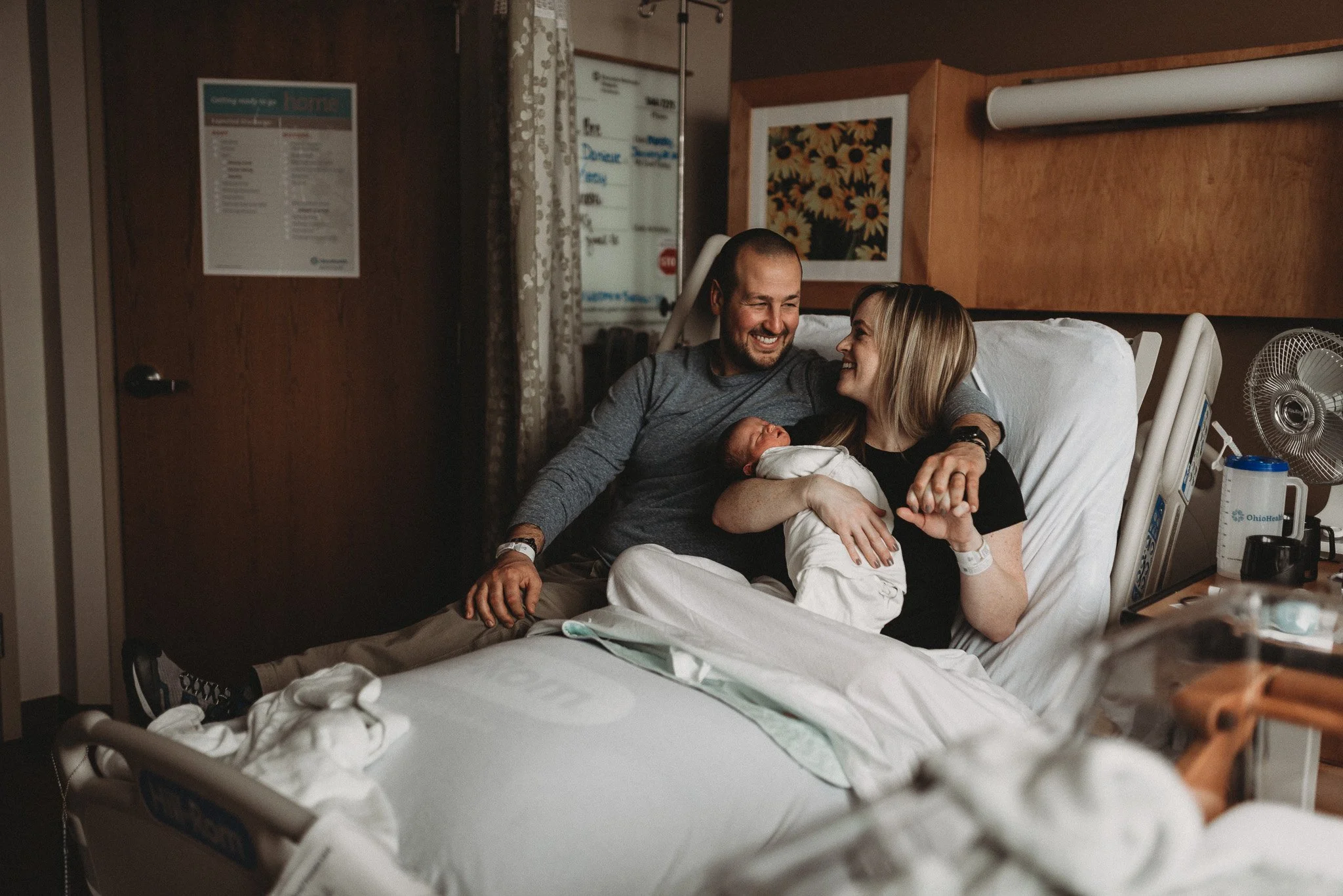 Lifestyle hospital photography with baby and parents in Lewis Center Ohio