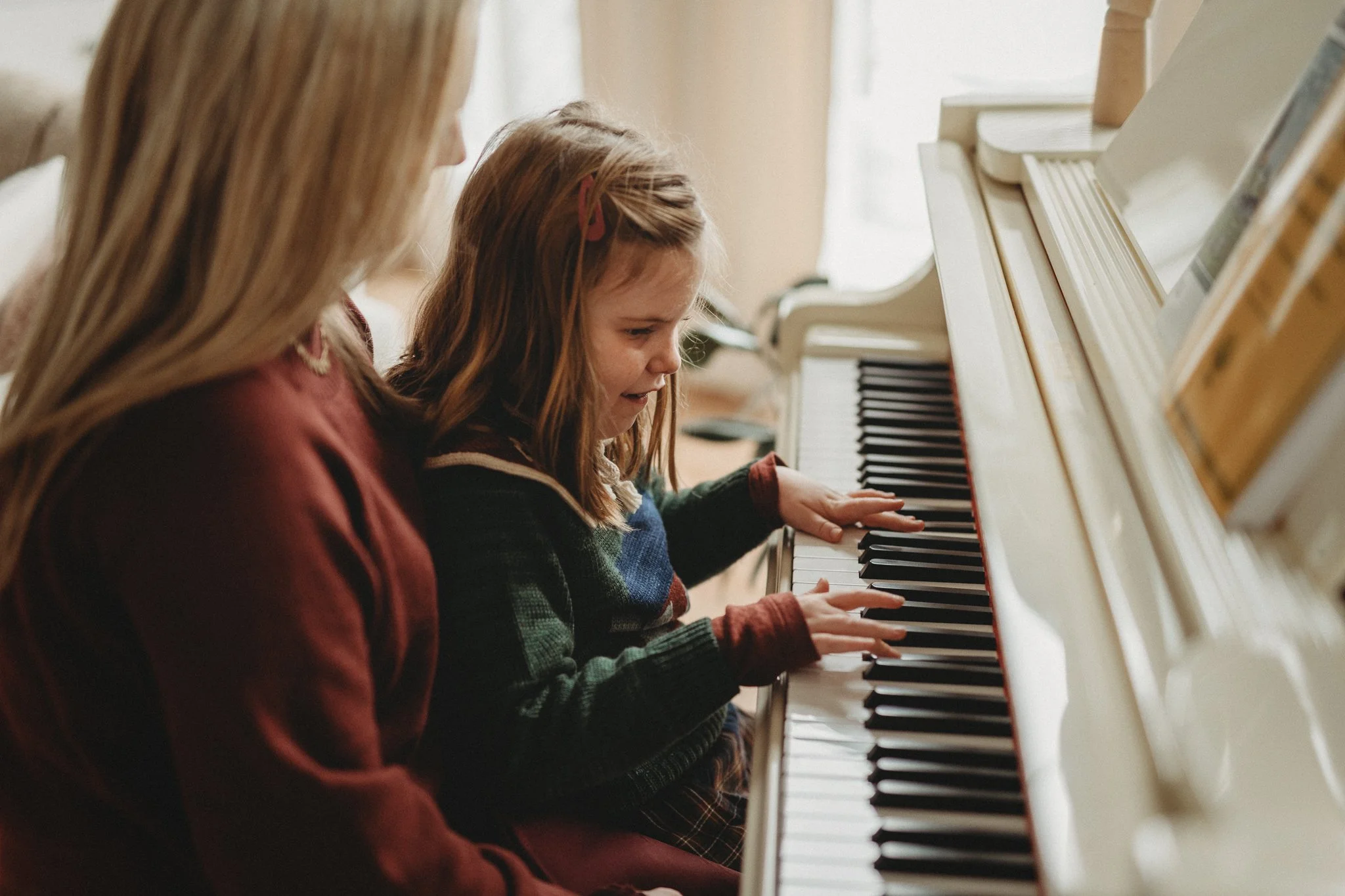 Mother and daughter playing piano during lifestyle and documentary photo session in Lewis Center Ohio