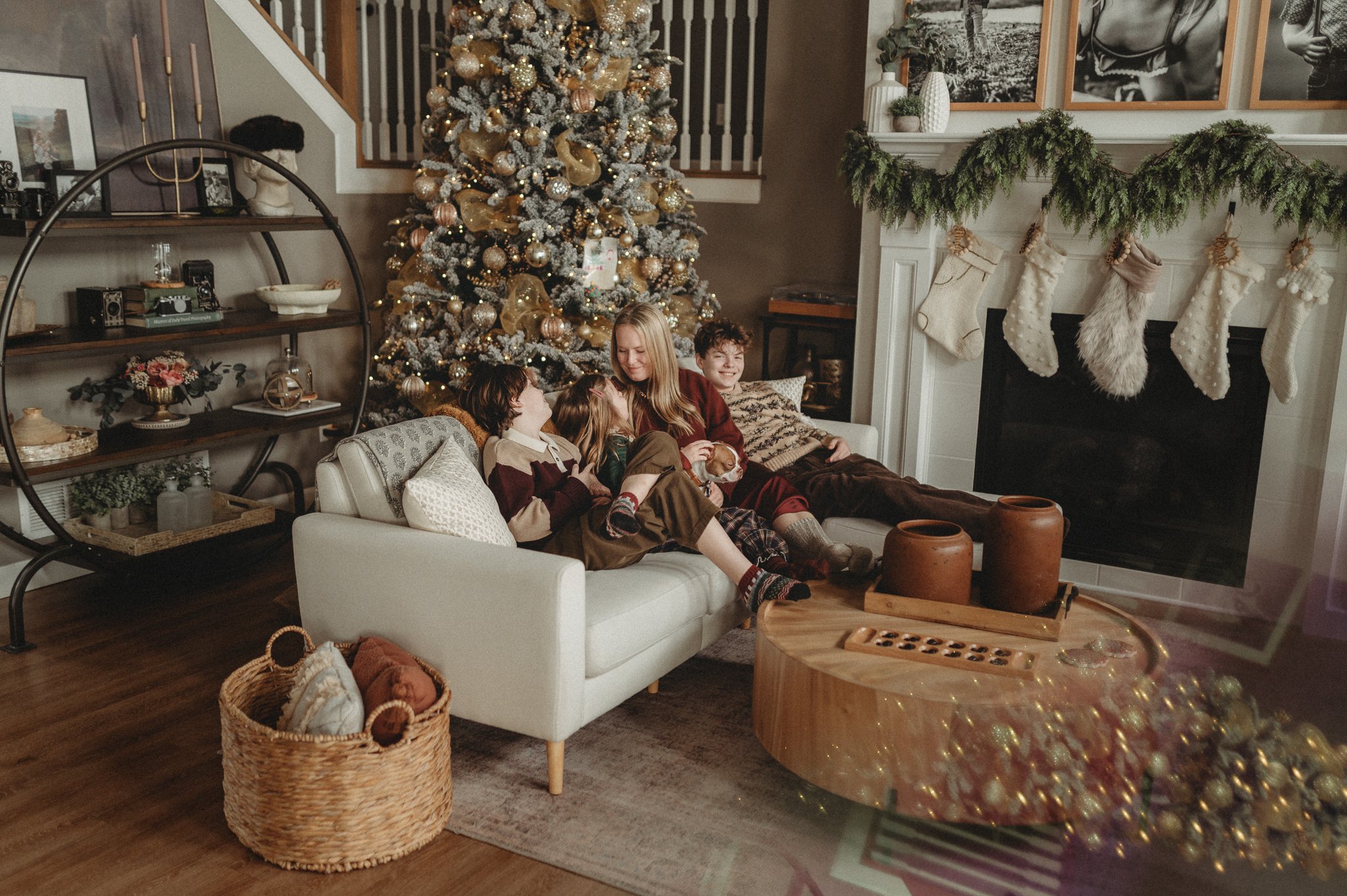 Mother cuddling on the couch with her children