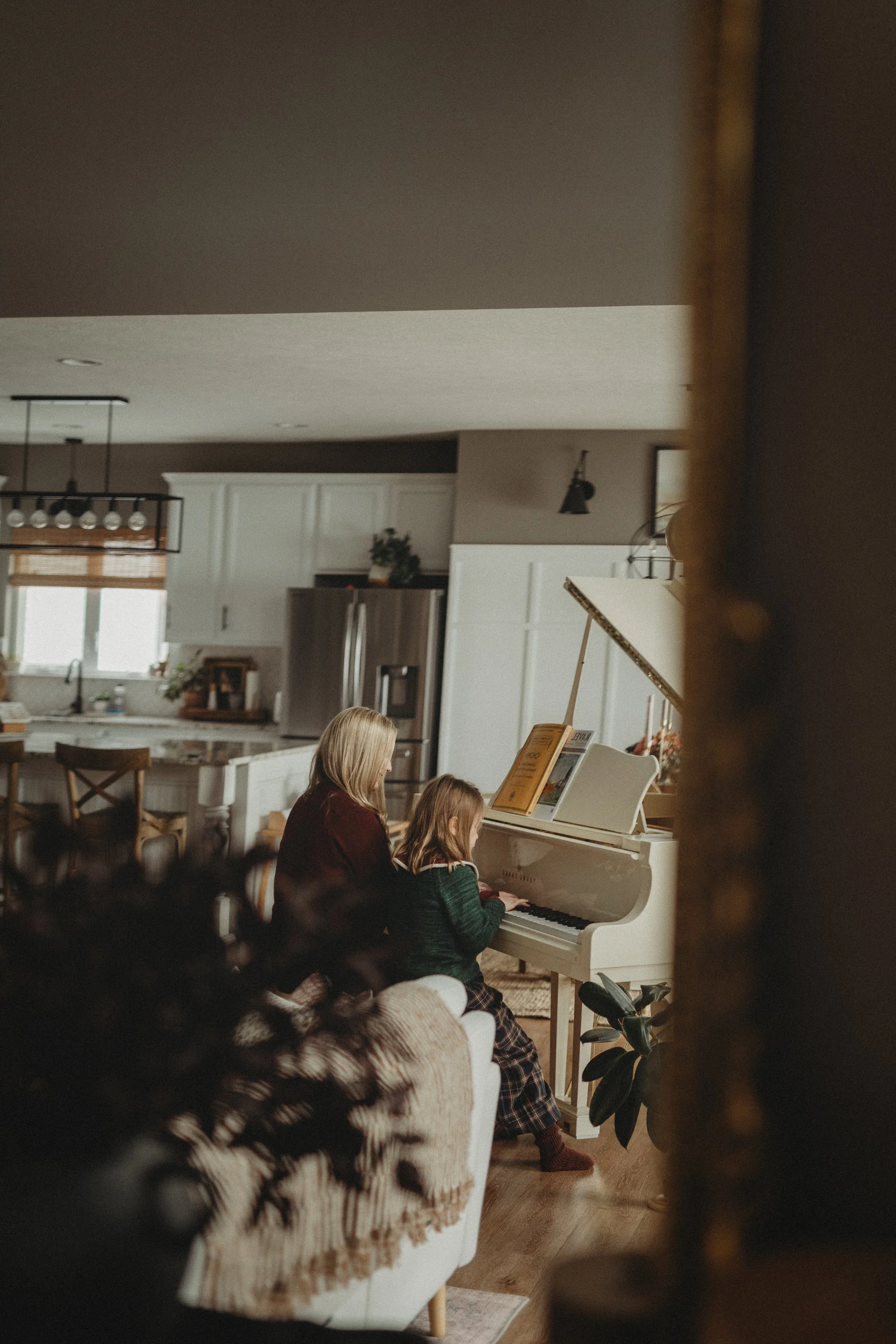 Mother and Daughter playing piano 