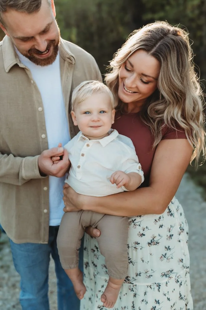 Family with one year old baby posing for a family photo