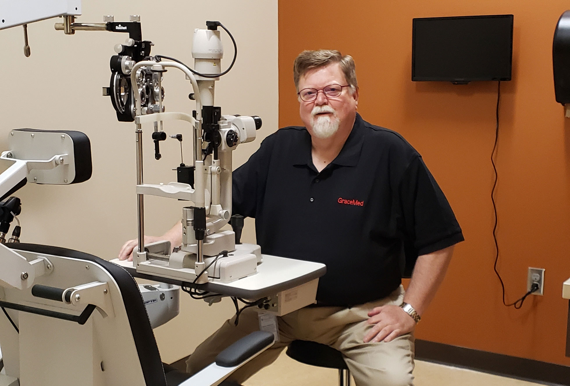 Dr. Mark Judd in an exam room at GraceMed Capitol Family Clinic