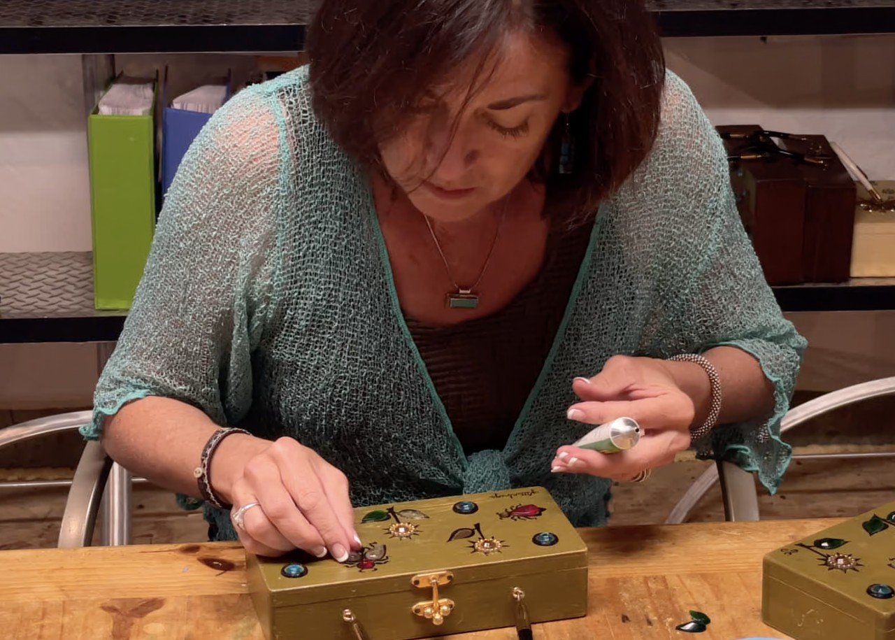  Karen Adler replaces jewels missing from a vintage Enid Collins box bag. She has no original design specs to work from. Instead, her expertise has been built by examining and documenting actual original bags for a decade. Credit: Michael Maloy, 2022
