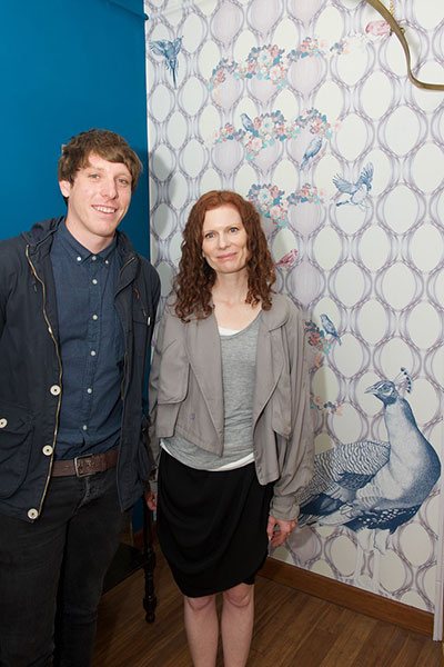 Kiersty with Michael from Murals Wallpaper and the final wall mural with Peacock, Canaries, Bullfinches, Goldfinches, Cockateel and Budgerigar.