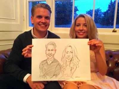 Happy couple with their wedding caricature