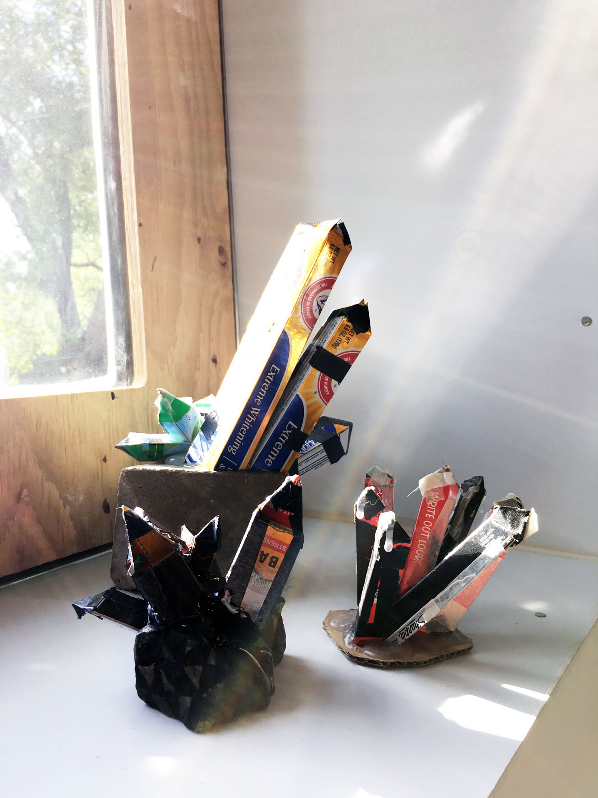 COLLECTION: Untitled (Tiger Balm), Untitled (Light Bulb), Untitled (Sharpie) cardboard, aggregate, concrete, permanent marker, tape, hot glue 2016