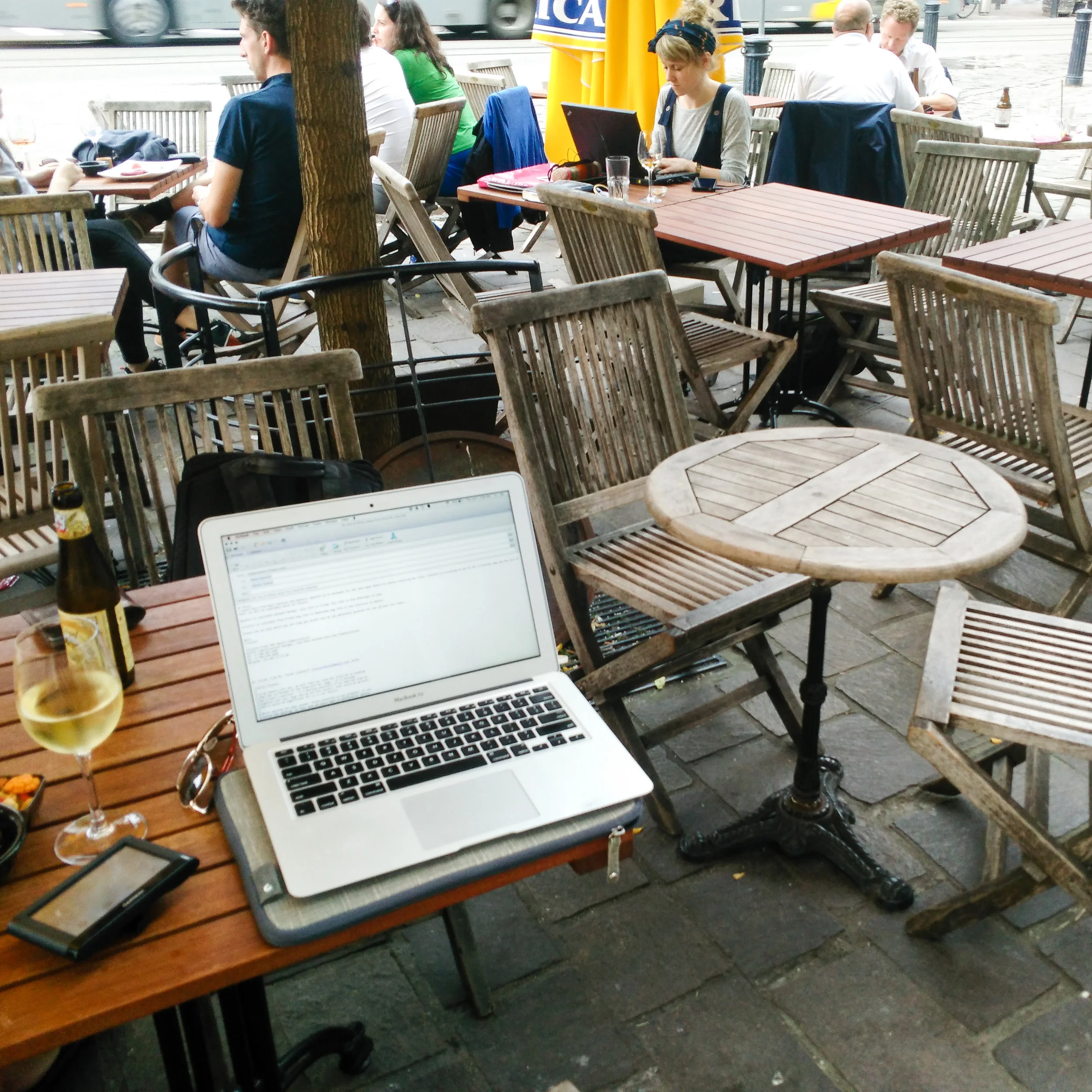 At my neighborhood bar in Gent. I was fighting with my Garmin and it was taking hours to get all the right maps on their (I have to switch installed countries several times a year). This meant a glass of wine was needed to proceed.