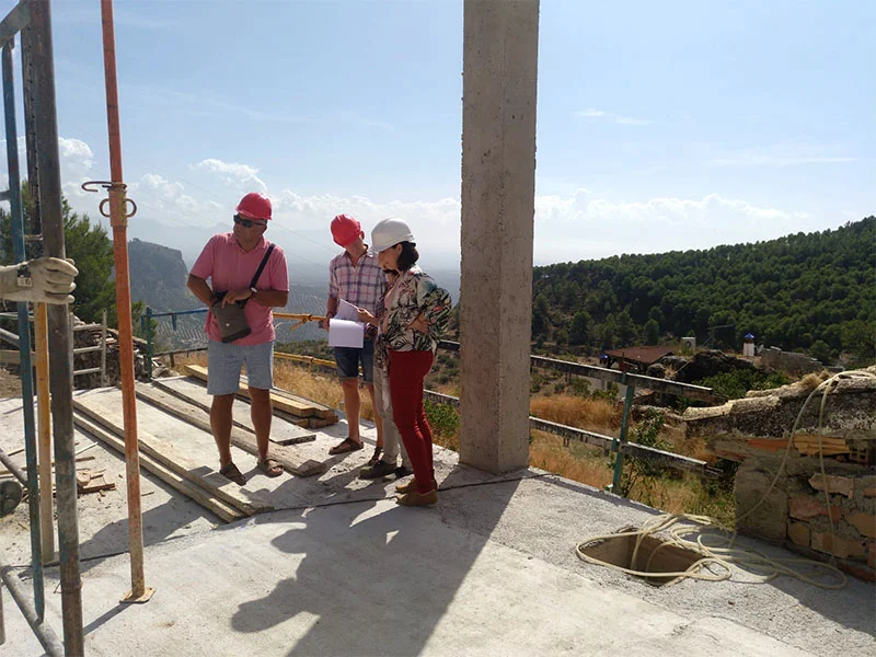 Looking glamorous in our hard hats, standing on the terrace