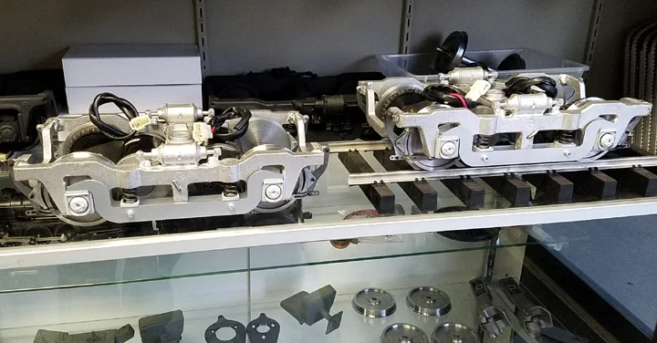 Here is a look at our 1" scale AAR trucks. Nicely cast in aluminum with full air cylinder castings on both sides integrally cast into the side frames for detail and strength. Metal brake shoes. Fully TIG welded with (4) 150 watt 24 volt traction motors with 4:1 reduction with chain drive. 40" cnc'd flat blacked drive wheels like the prototype. Fully sprung and equalized as well. Price: $1700.00 per pair