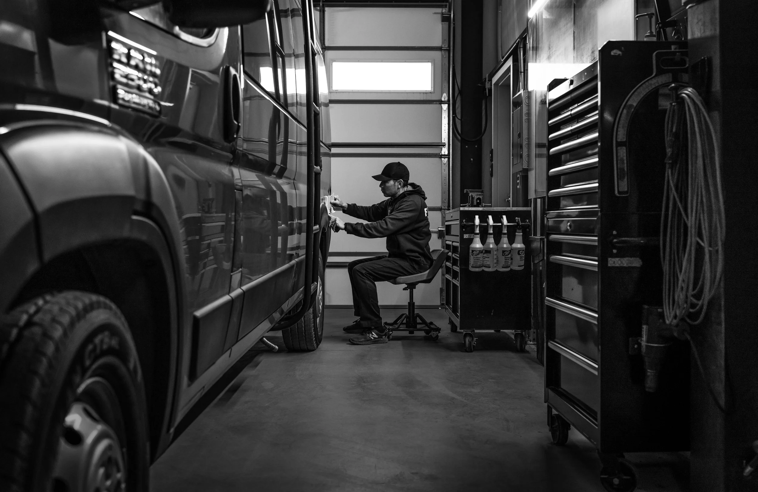 Decal installation on Promaster Van.
