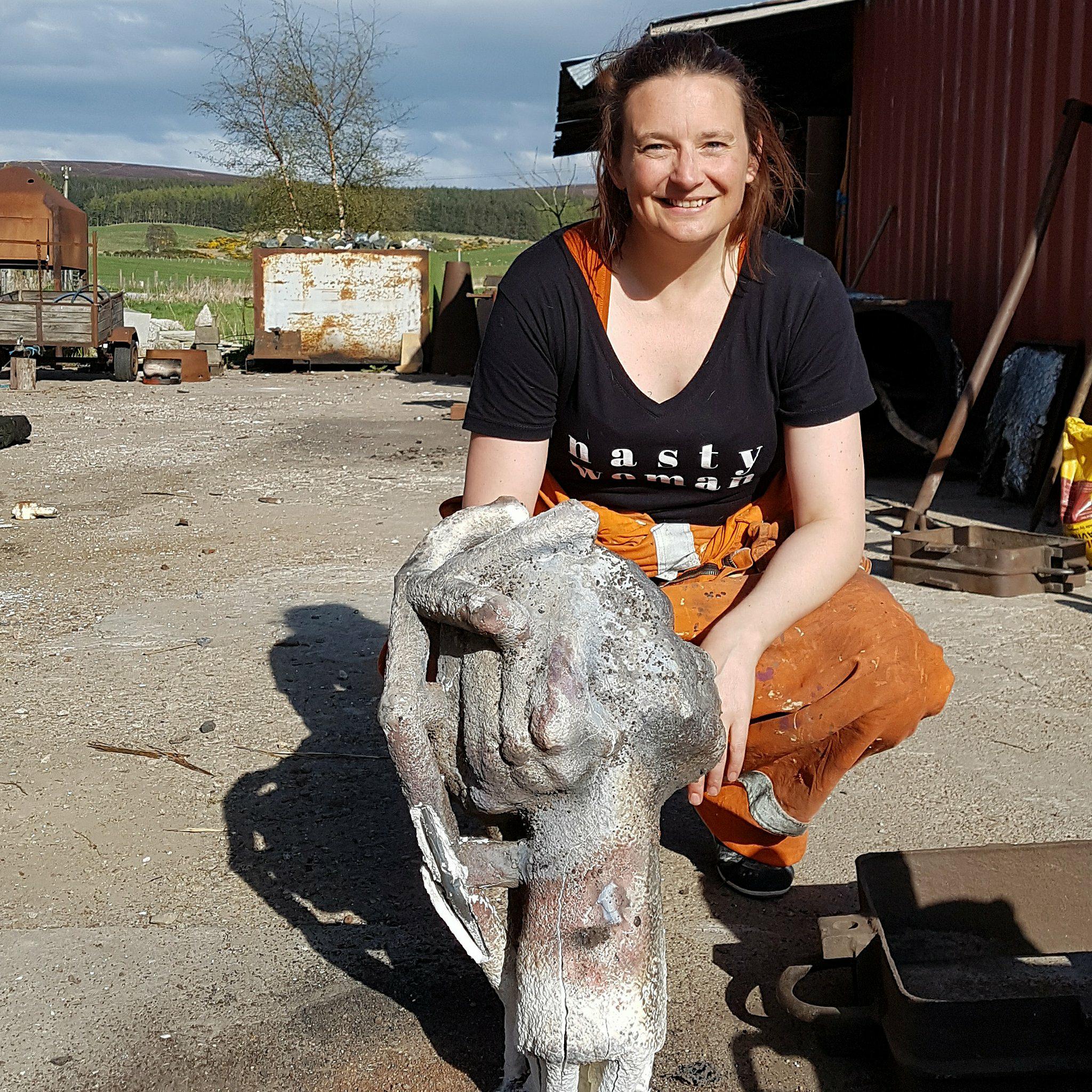 Post bronze pour, pre-removal of ceramic shell