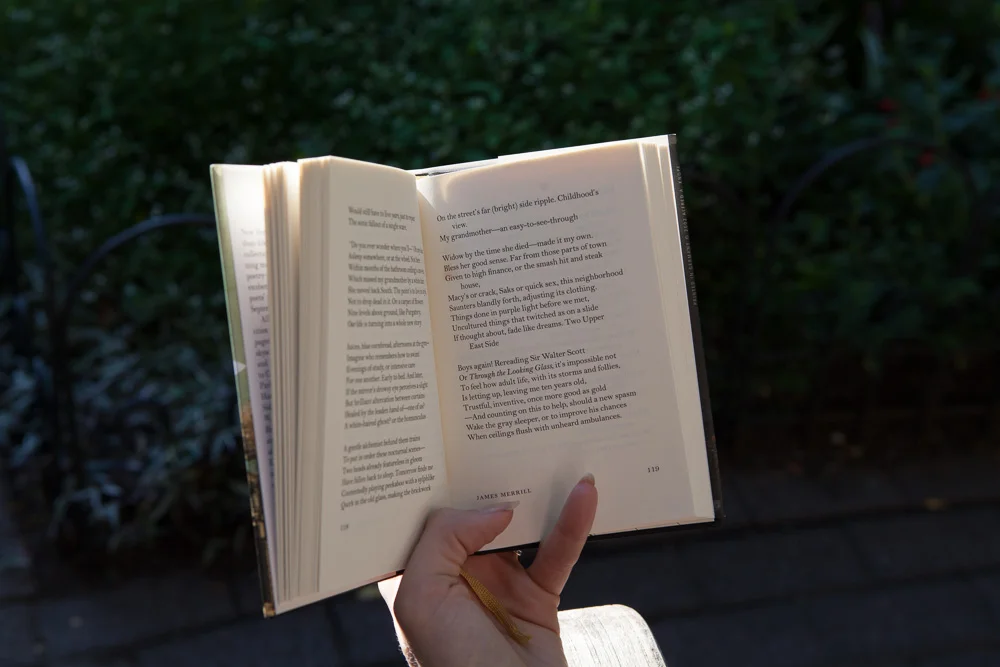 Kelsey reads in the sunshine of local favorite reading spot - The Jefferson Market Garden. 