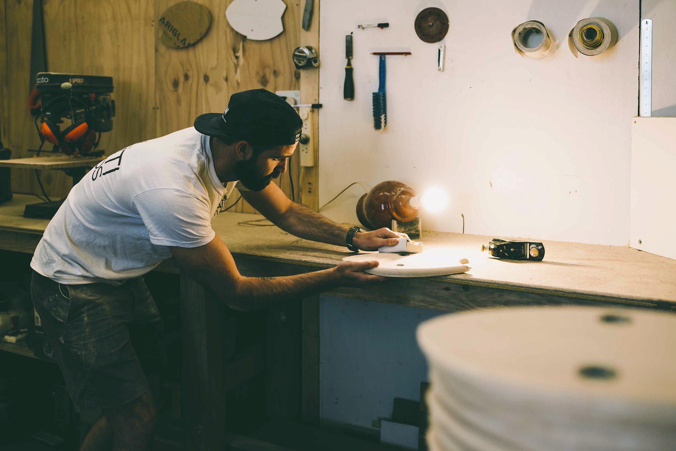 Rikki Gilbey of WAW Handplanes, forging his body surfing boards in his studio at Nauti Studios.jpg