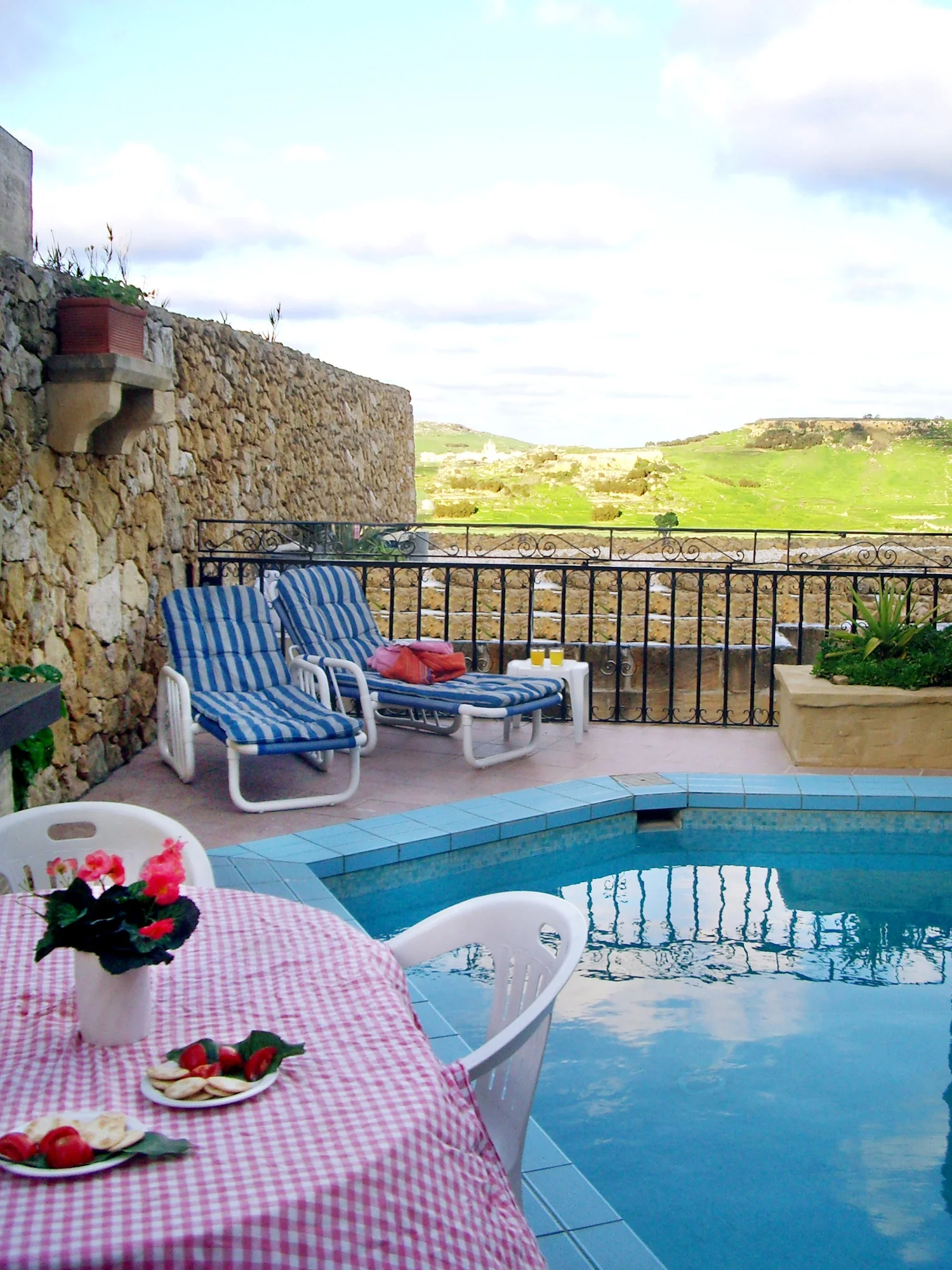 Pool terrace with BBQ area and views