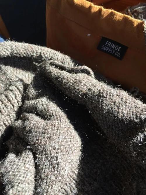 It's gone a lot of places, this Anker's cardigan