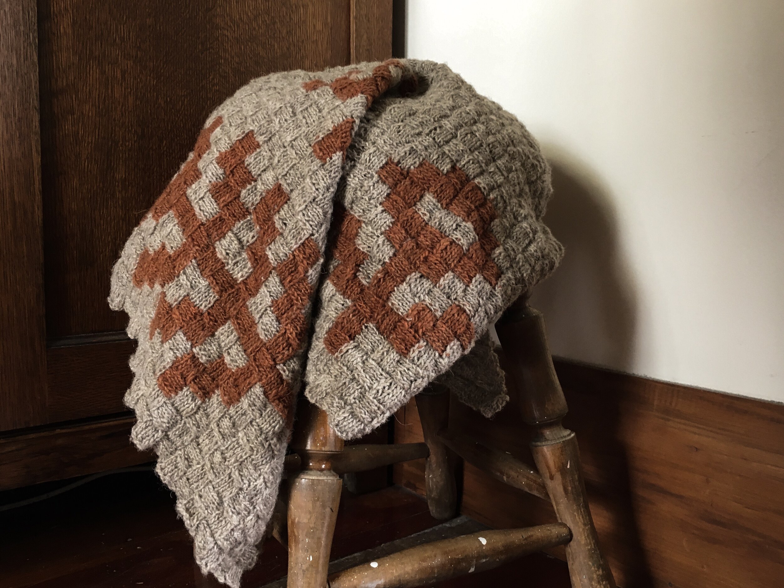 Frances dyed the rusty colour of Moeke yarn herself, using madder root, to complete this Grandma Shawl by Junko Okamoto.