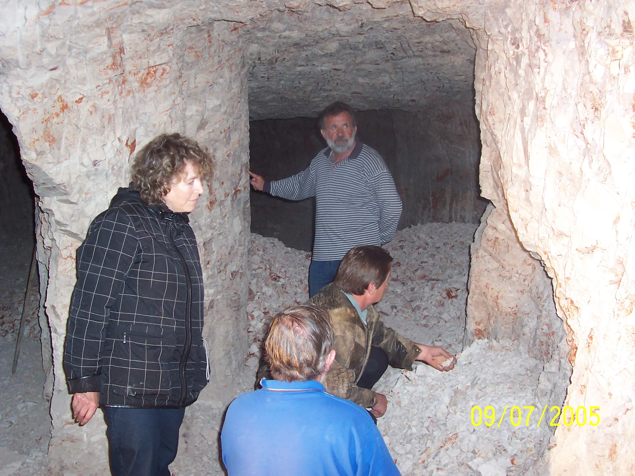 Members of the expedition in the opal-bearing mine. In the foreground is the lead scientist of the expedition D.Sc. Liudmila Volkomirskaya.