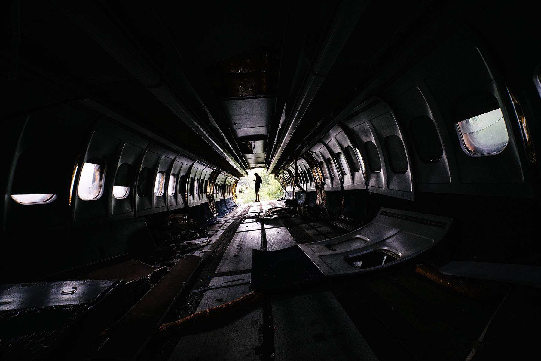 It is an eerie feeling walking in a forgotten plane with all the seats stripped out and the tail cut off.