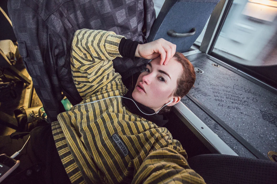 exhausted lying down in the back of the bus after a long day. Phew - we made it!