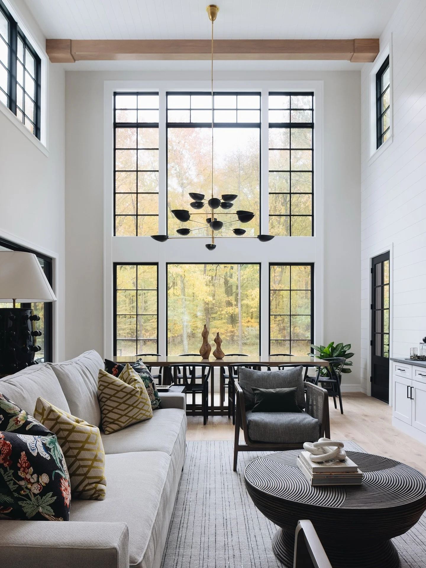 A 360 Degree View of our Wild Turkey Retreat-

The Great Room and Dining Room create a warm, welcoming atmosphere, with the expansive atrium showcasing the breathtaking woods beyond. Rich beams and a statement fireplace mantel bring depth and sophist