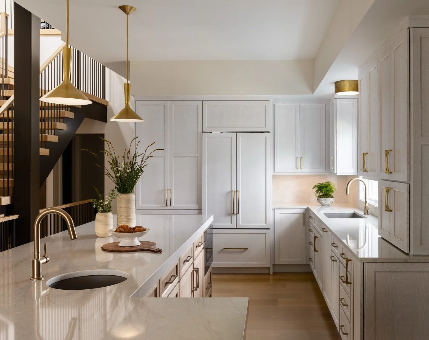 This warm and cozy kitchen features MSI's Lumataj Quartz for the counters and back splash. It's LumaLux Technology enhances light interaction for a luminous effect.

We initially discussed Taj Mahal Quartzite but when we shopped for slabs, the materi