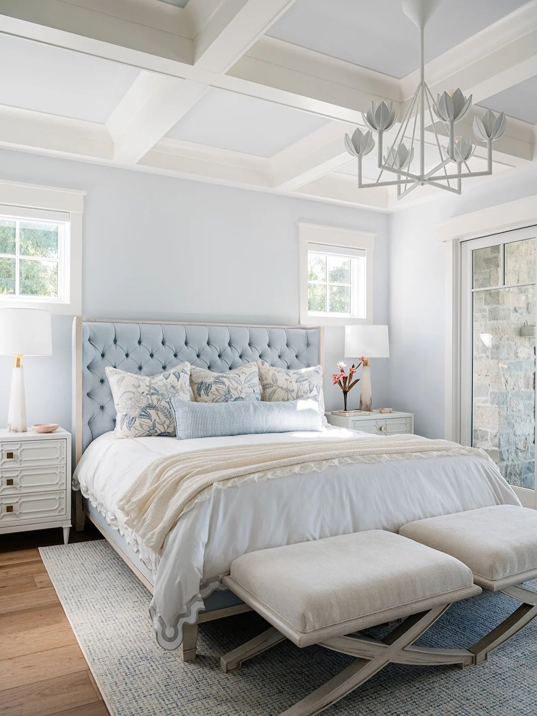 The lake might be freezing but this Primary Bedroom facing Lake Michigan is light filled and dreamy all year around. 

The custom furniture by Vanguard Furniture and the custom ceiling treatment give this room a luxe elevated feel in keeping with the