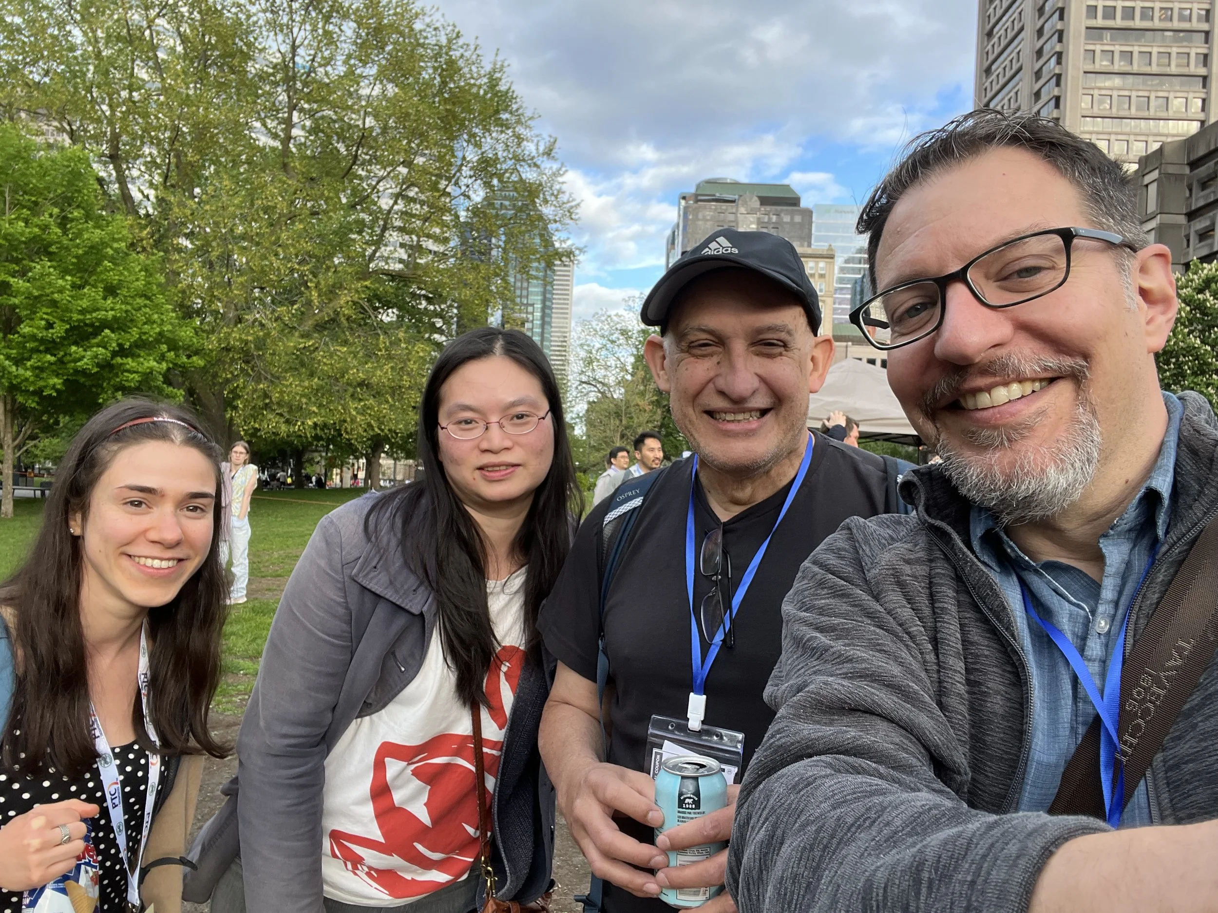 Obligatory biennial photo with Juan Alfonzo witnessed by Eliza Lee and Jennifer Porat. Taken at the RNA Canada BBQ on the McGill campus (2026 RNA Society Meeting).