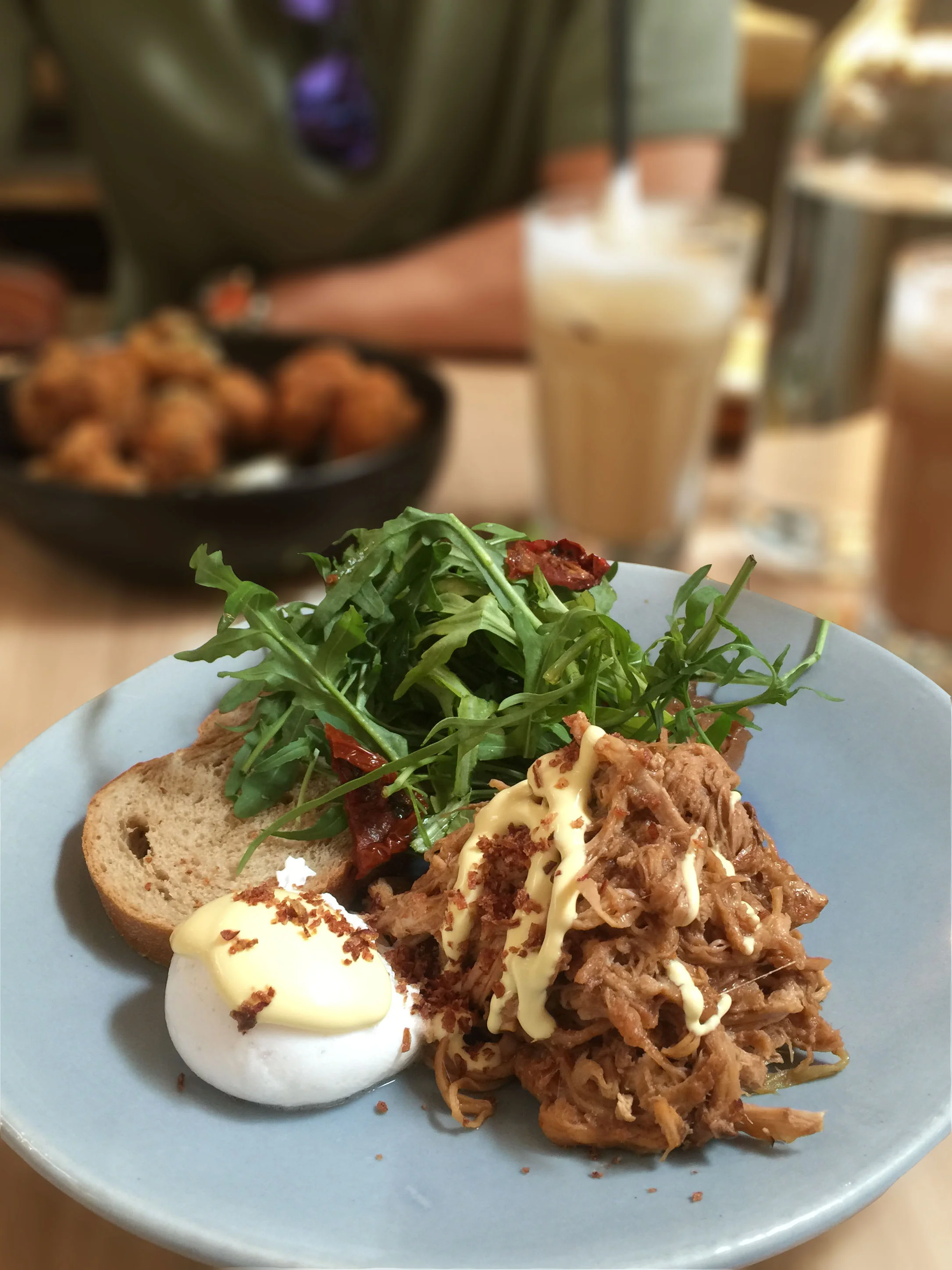 Pulled Pork on Sourdough coupled with Poached Egg & Hollandaise Sauce with Purple Cabbage & Arugula