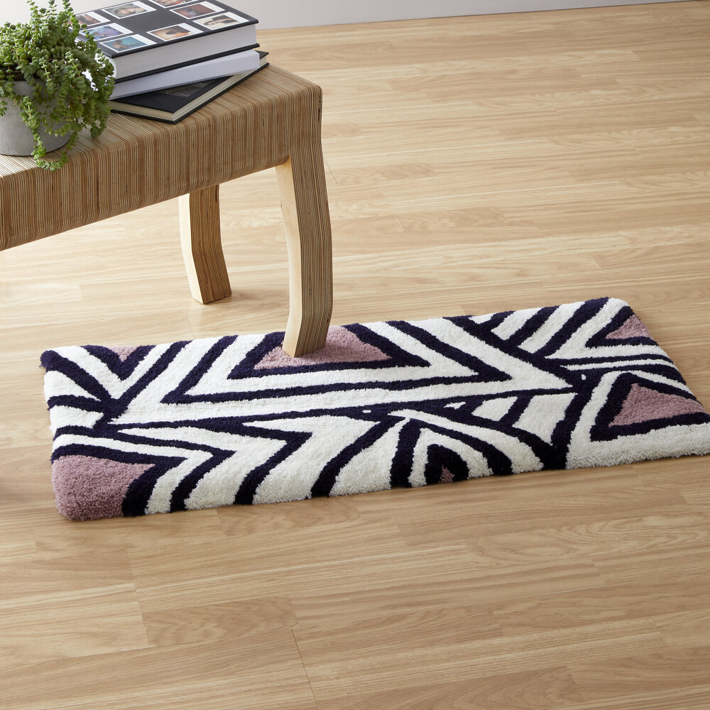 Hand made rectangular white and purple rug, by Hannah Heys Textiles