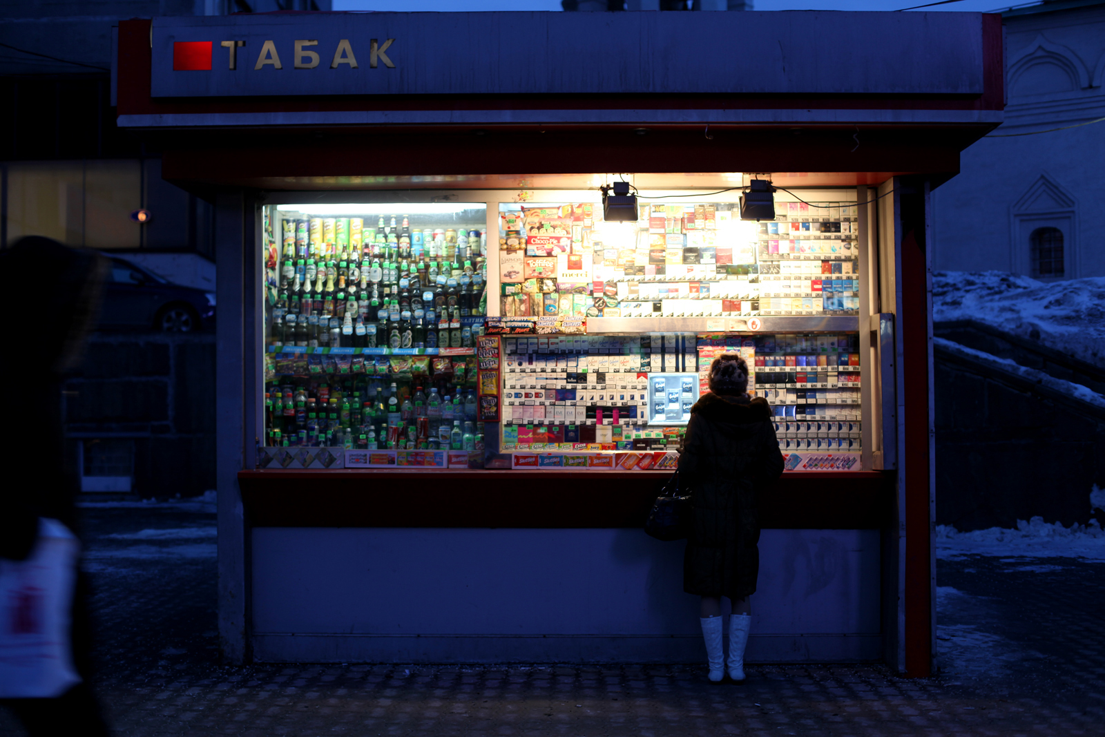 A sidewalk shop selling cigarettes, alcohol, and snacks, Moscow, Russia