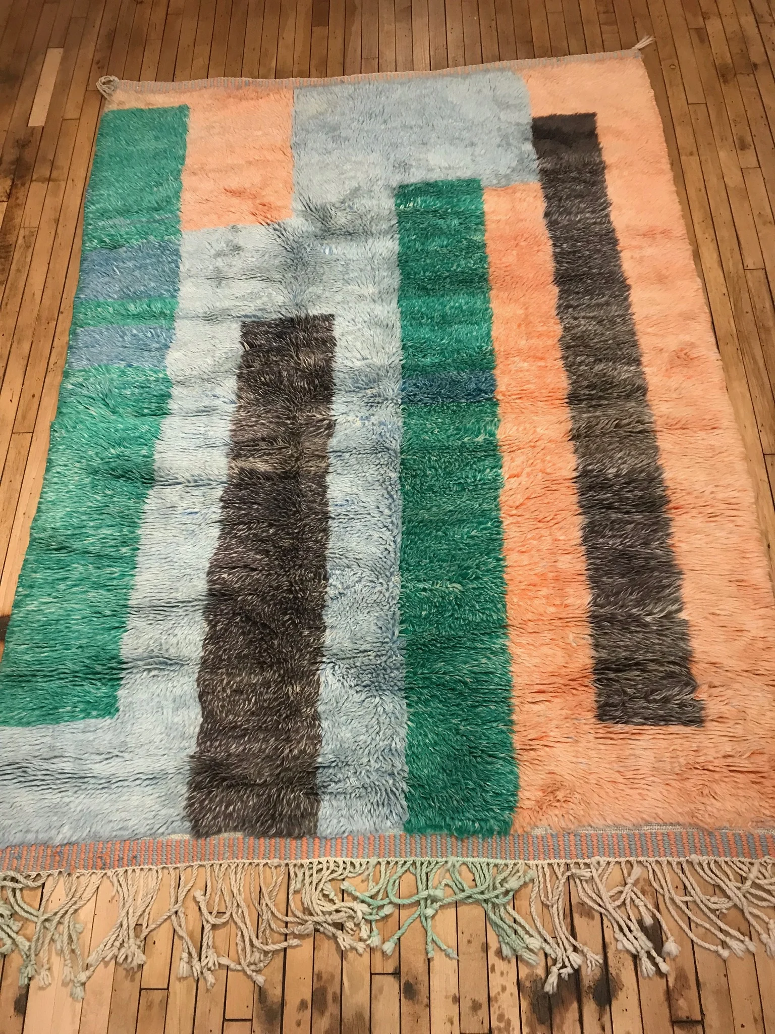Easter colour rug on wooden floors at Mellah Moroccan Rugs in Toronto