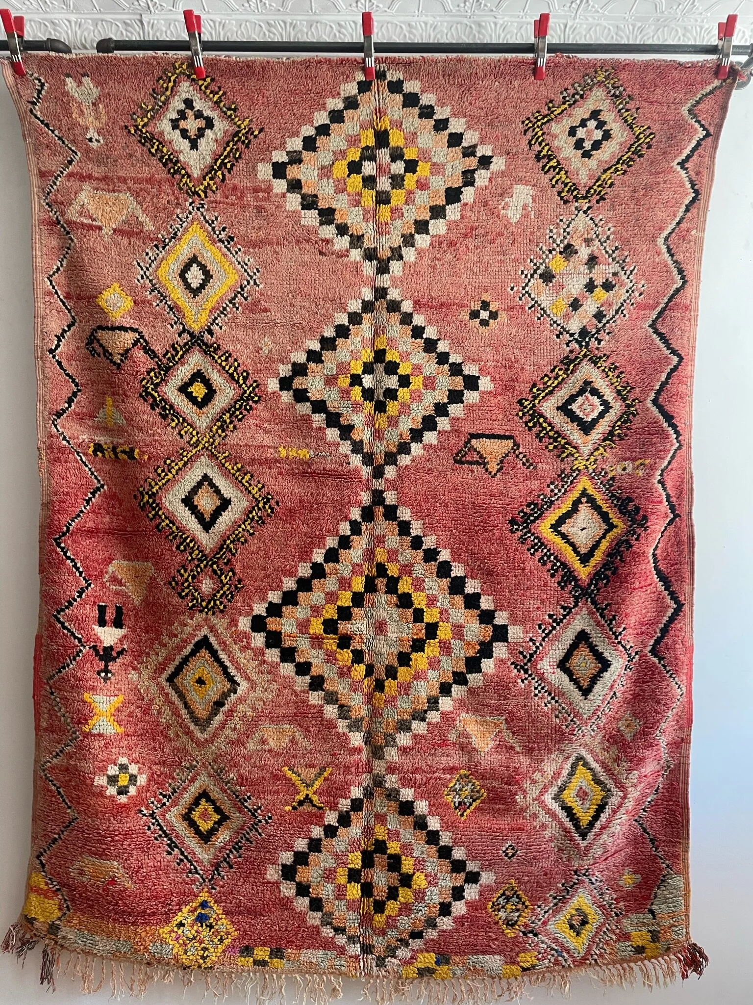 Vintage pink moroccan rug with black and yellow diamond designs