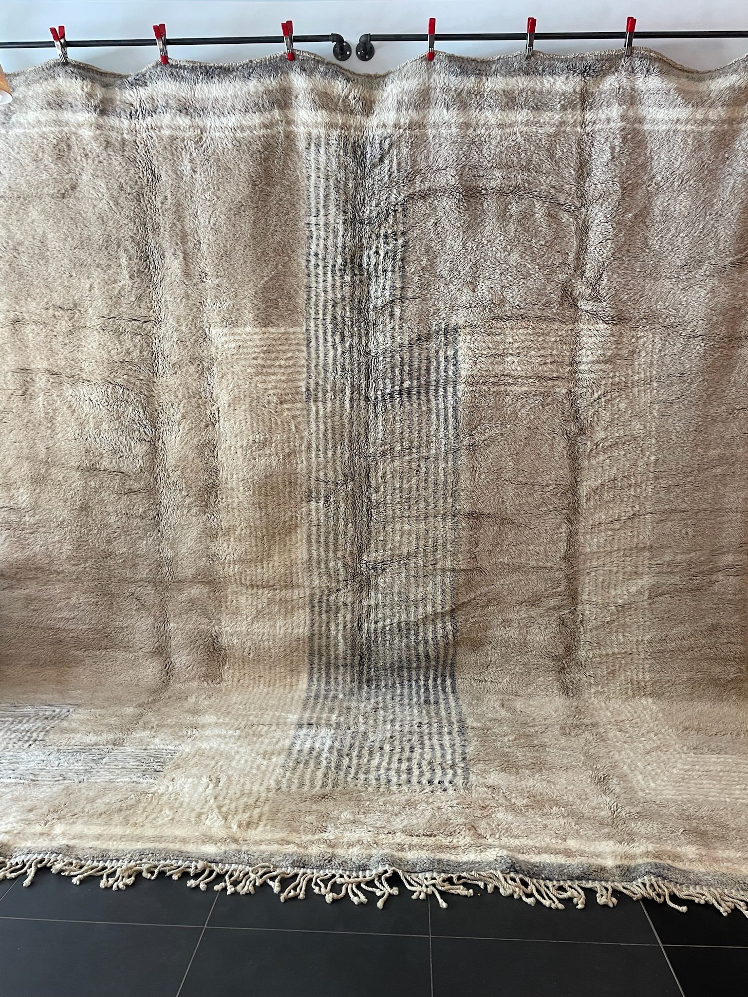 oversize modern Moroccan hand-knotted wool rug in sand with cream and grey lines