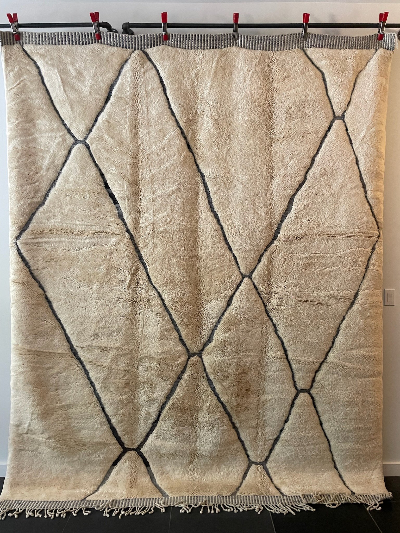 large hand-knotted cream Moroccan wool rug with dark blue kilim diamond design
