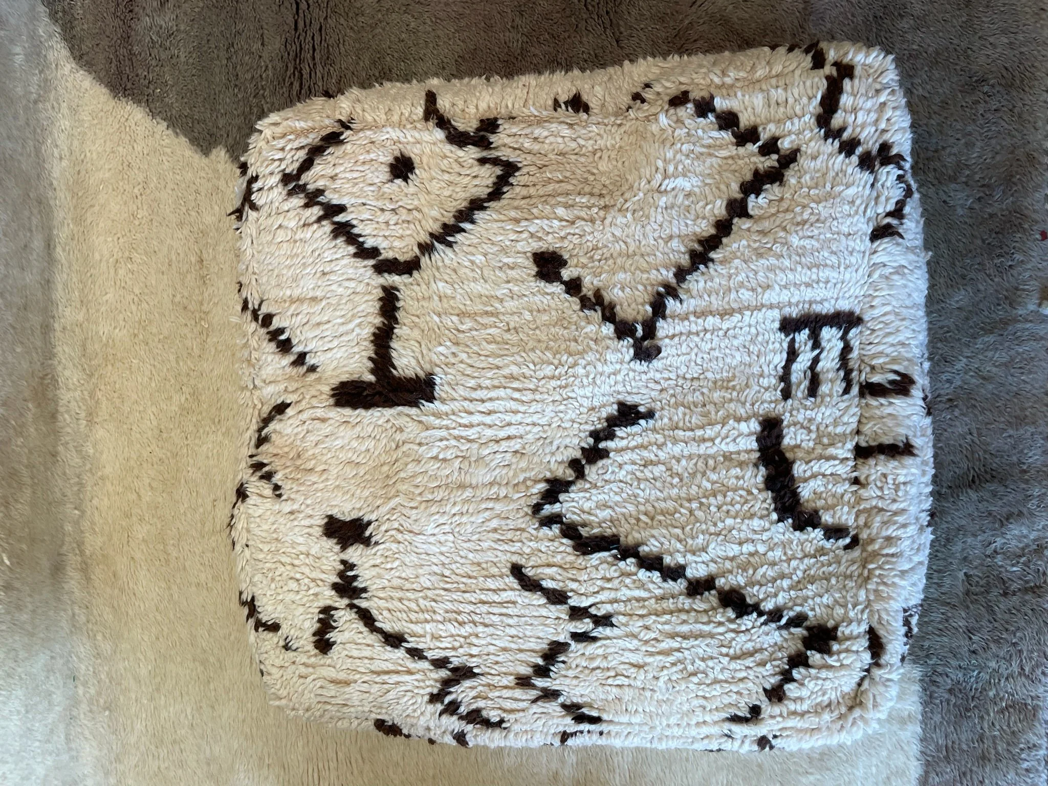 Cream Moroccan floor pillow with brown berber designs