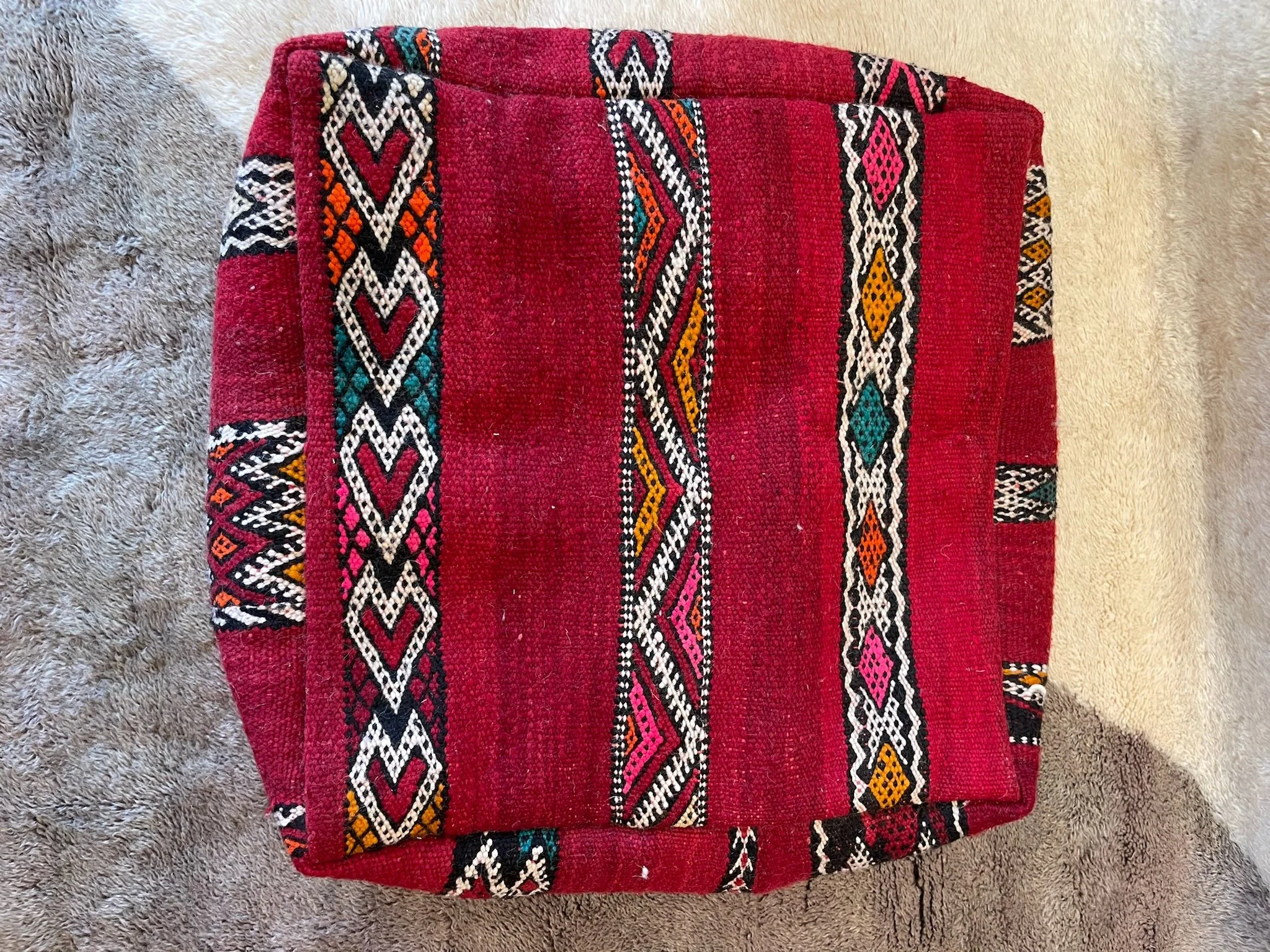 Red Moroccan floor cushion with colourful striped bands