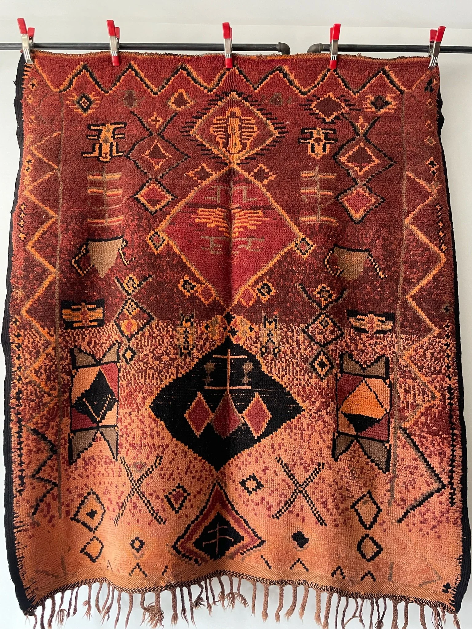 Vintage hand-knotted Moroccan wool in burgundy with peach grey and black designs